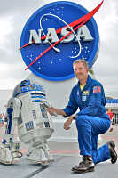 Astronaut Jim Reilly helped welcome R2-D2 and Luke Skywalker's lightsaber from Star Wars to the Kennedy Space Center. The lightsaber is being taken into space aboard the real-life spacecraft Discovery during mission STS-120.
